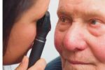 Aging man getting eye exam
