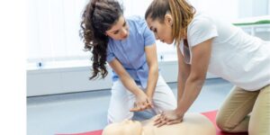 A caregiver learning how to perform CPR